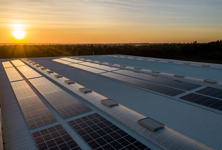 Rooftop solar panels at sunset